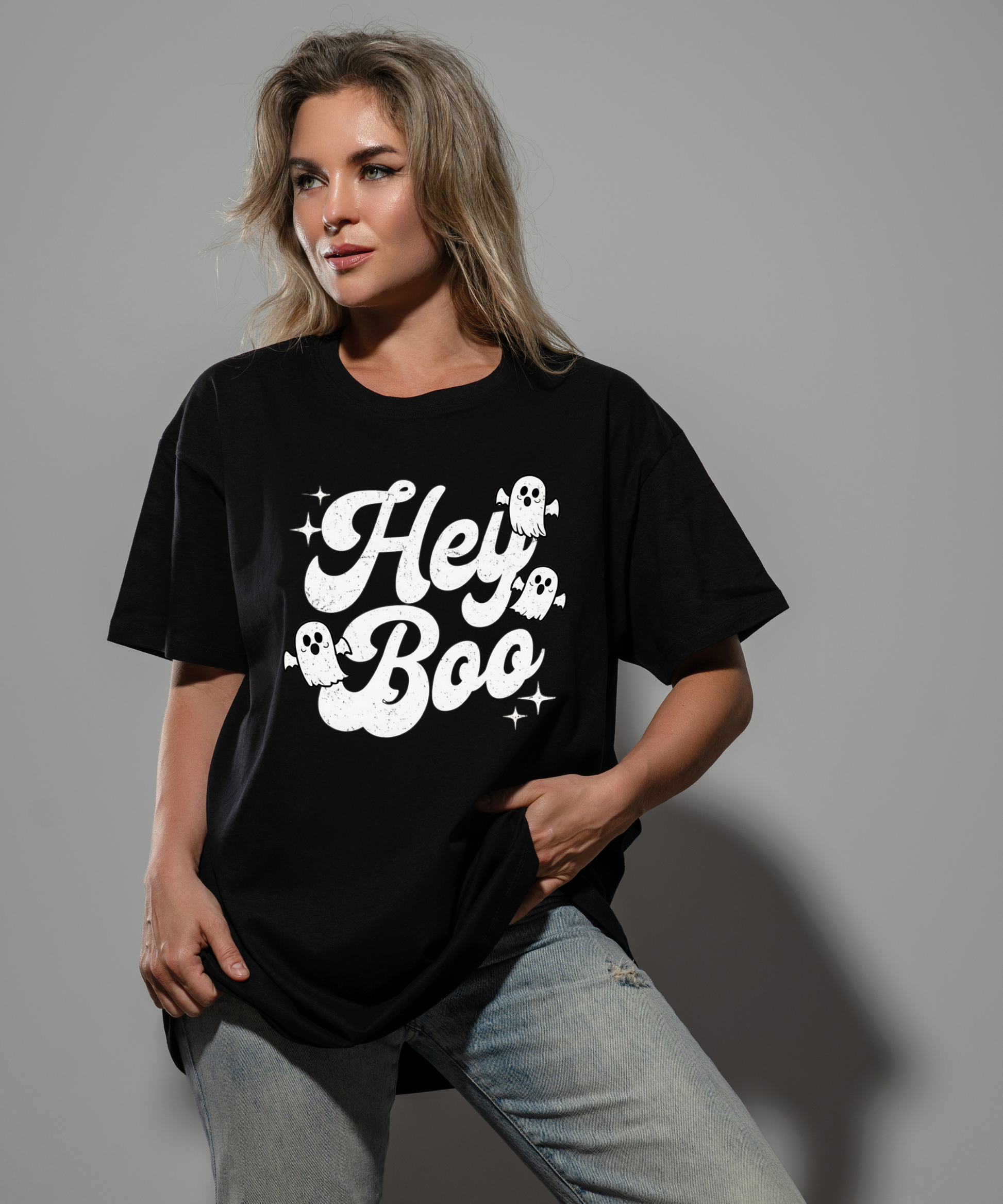 Vintage hey boo writing with 3 retro ghosts and stars on a black tee